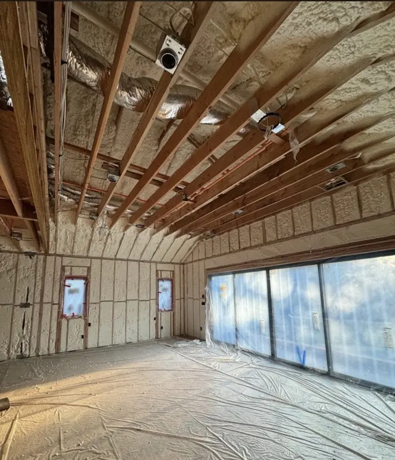 Interior walls and ceiling insulated with spray foam during new construction in Shrewsbury